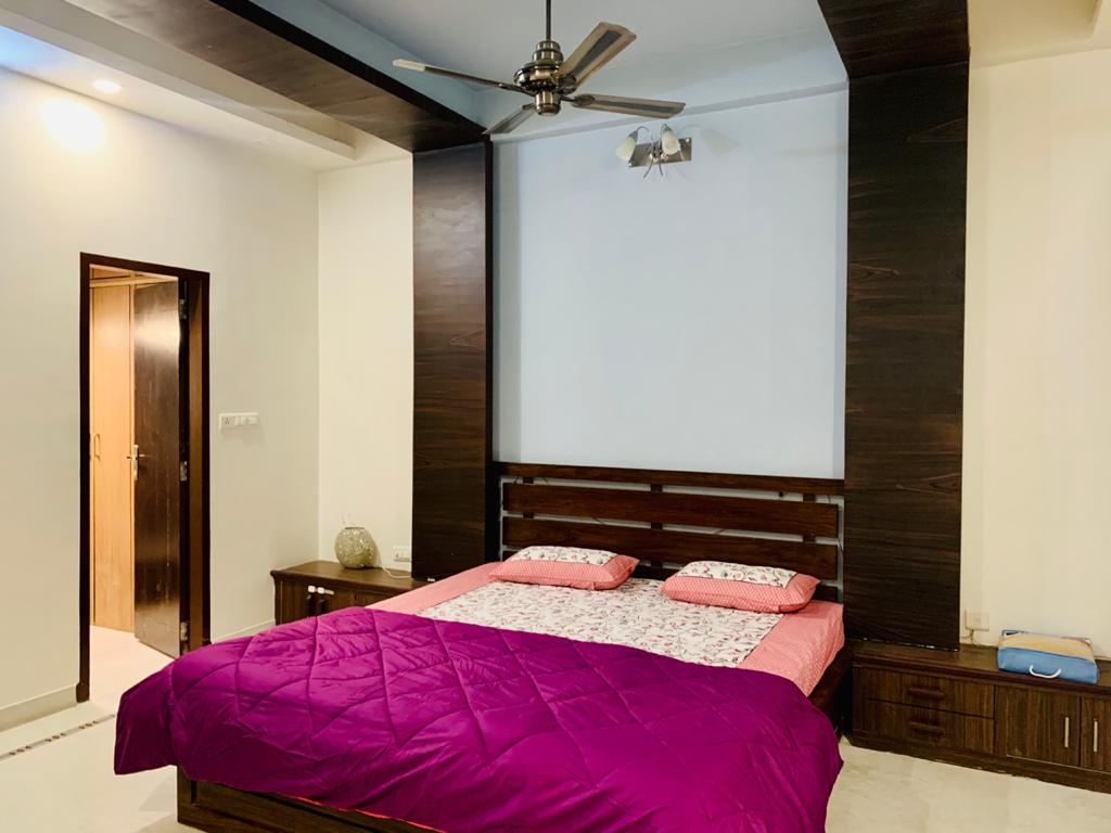 Single occupancy AC room with study table at Anand Luxury Girls Home, Jagatpura