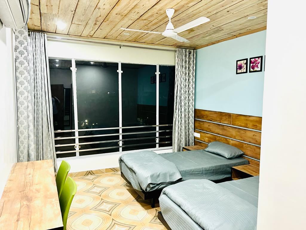 Twin sharing AC room with 8-inch mattresses at Anand Luxury Girls Home, Jagatpura (photo 3)