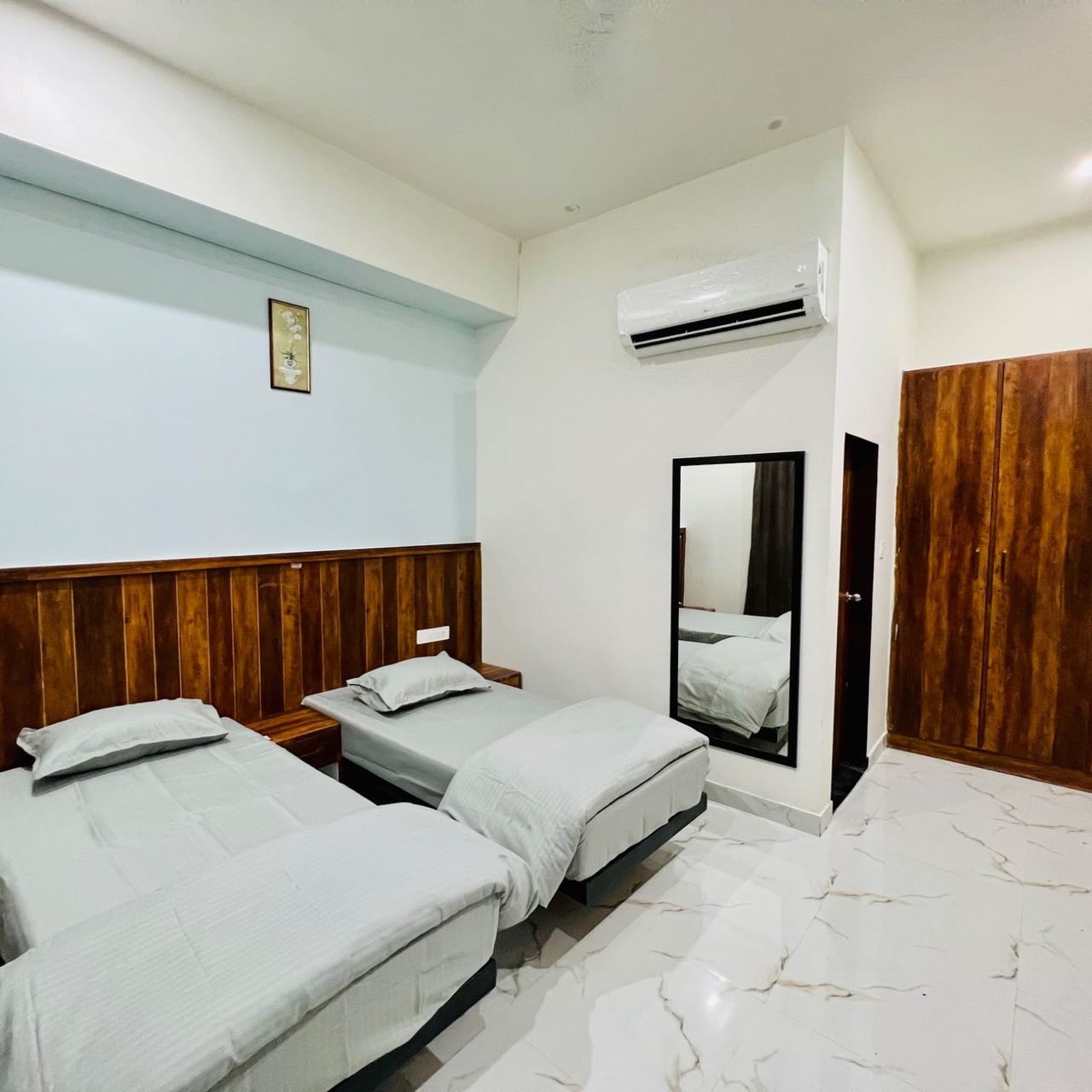 AC room interior with wooden wardrobes at Karol's Villa Girls PG, Malviya Nagar