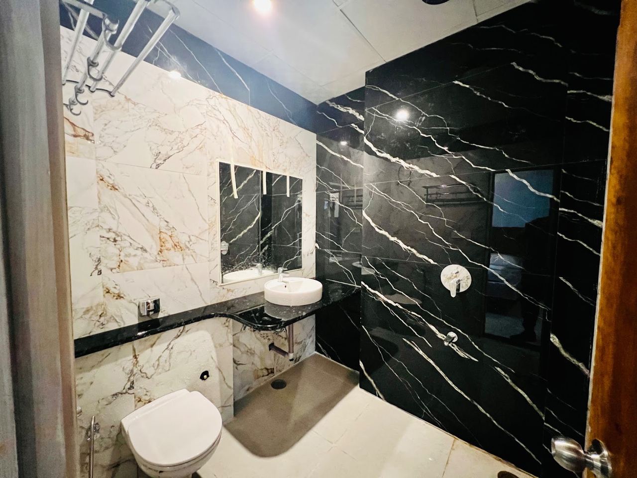 Attached washroom with pressure shower at Karol's Villa Girls PG, Malviya Nagar (photo 2)