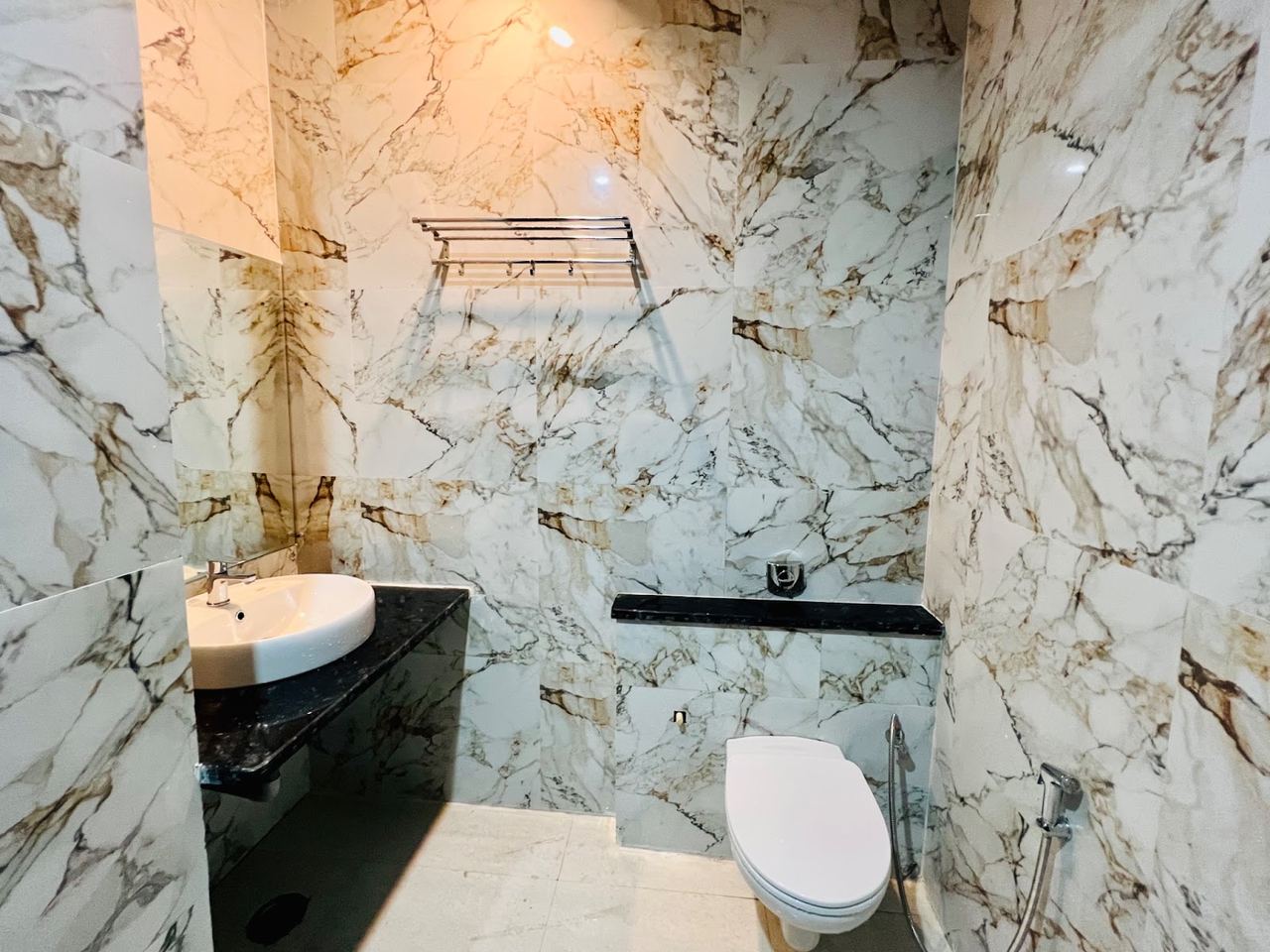 Attached washroom with pressure shower at Karol's Villa Girls PG, Malviya Nagar (photo 3)