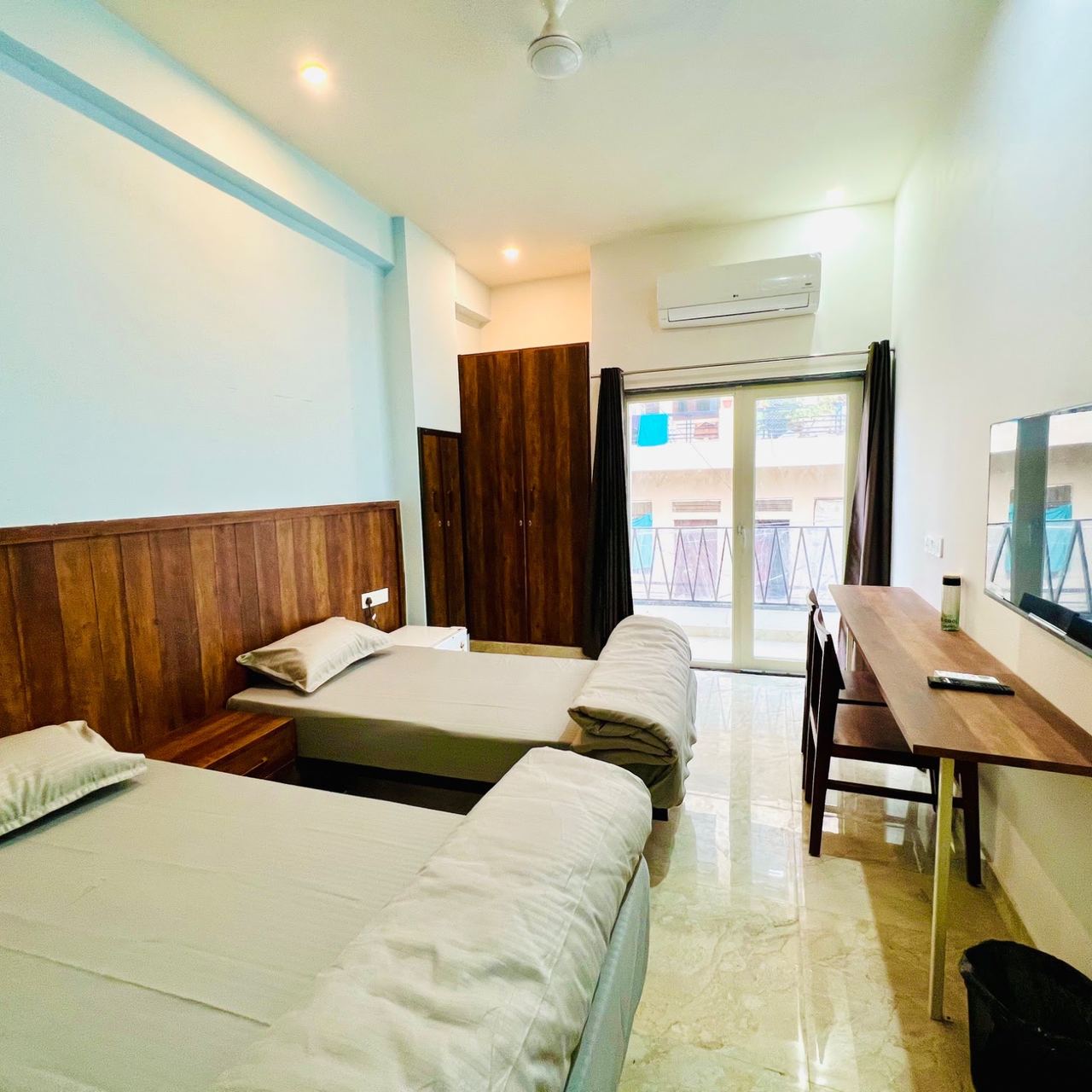 Twin sharing room with balcony access at Karol's Villa Girls PG, Siddharth Nagar, Malviya Nagar