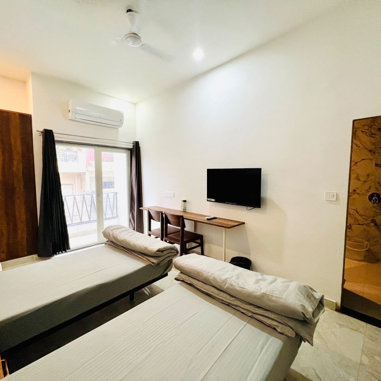 Room with study desk, TV and wardrobe at Karol's Villa Girls PG, Malviya Nagar